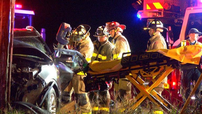 Driver rescued from vehicle after crashing into pole on North Side