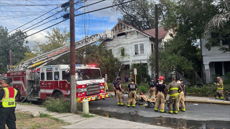 Roughly 100 firefighters battle double house fire near downtown, SAFD says