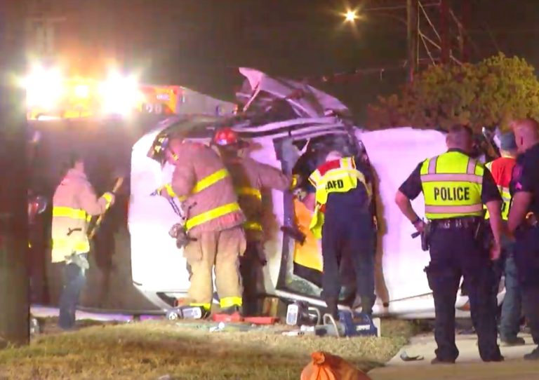 Driver rescued after hitting pillar, rolling over truck on North Side