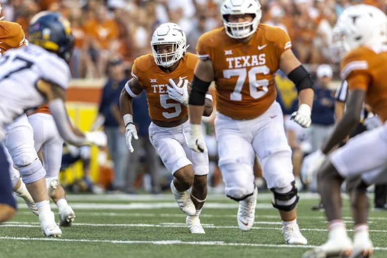 Card to Worthy connections lead Texas over WVU 38-20