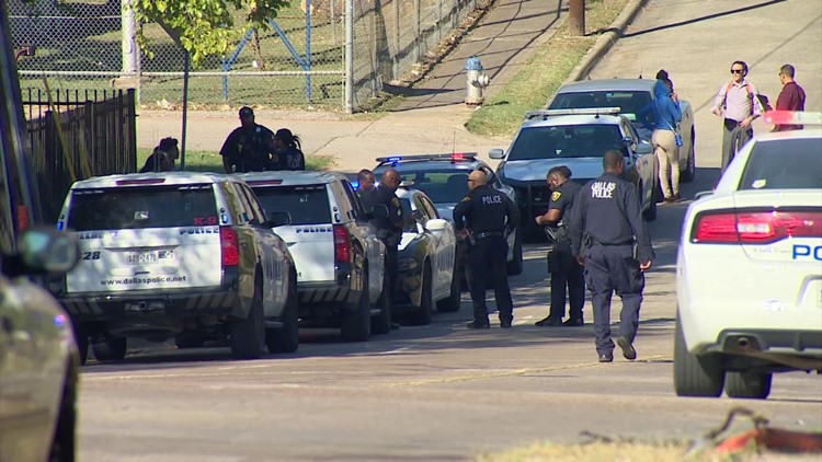 Community groups rally support near a Dallas high school after two off-campus shootings nearby