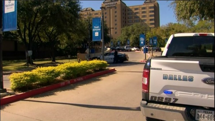 After killing two Methodist Hospital employees, gunman reportedly reloaded weapon and started to walk into hallway before being shot, police say