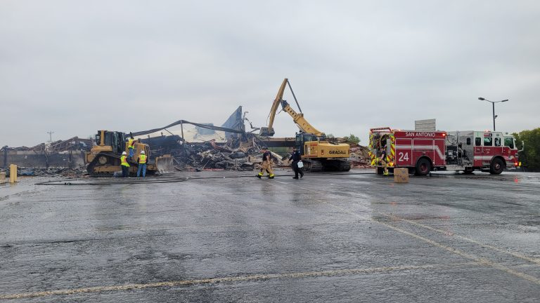 City crews begin tearing down former Midnight Rodeo that went up in flames