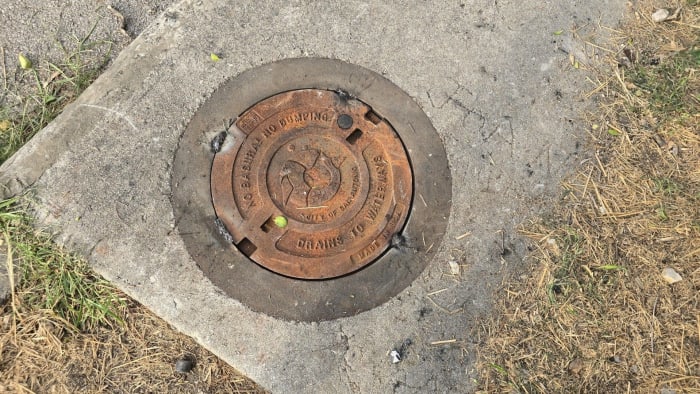 Someone regularly stealing manhole covers in area where woman fell six feet down, neighbors say