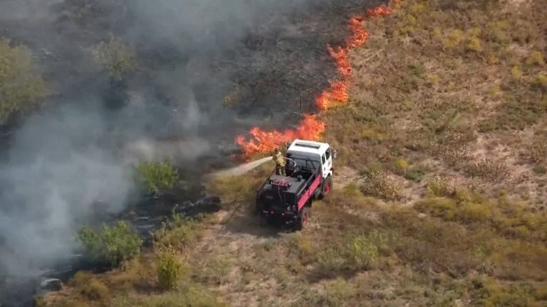 VIDEO: First responders putting out grass fire in North Texas