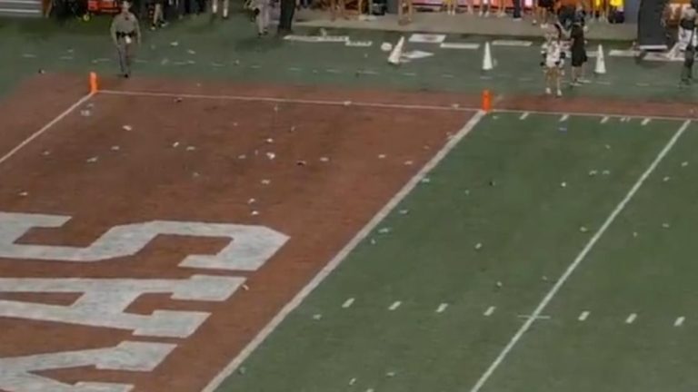 Disgruntled Longhorn fans throw beer cans, water bottles and more on the field, causing delay in game against Georgia