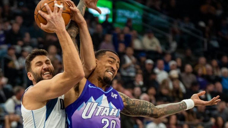 John Collins scores on a late dunk to lift Jazz past Mavericks for 1st home victory