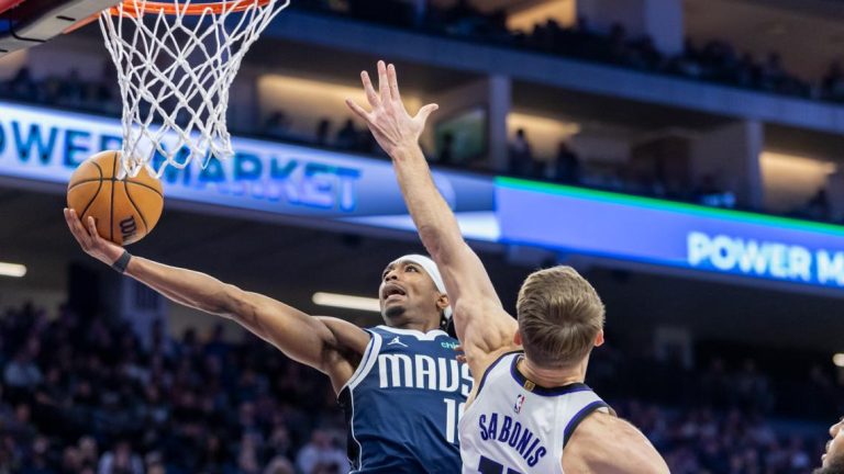 Fox has 33 points, Kings beat Mavericks 110-100 as Christie wins first after becoming interim coach