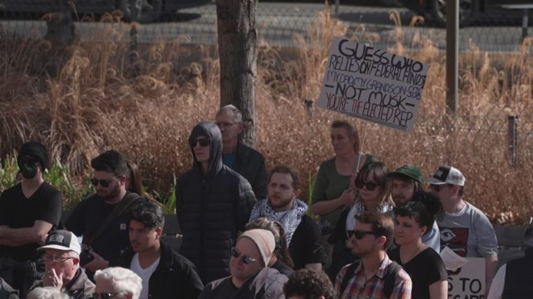 Protesters gather in downtown Dallas to voice frustrations over cuts to the federal government